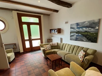 Gemütliche Sitzecke in der Diele Gemütliche Sofaecke im Eingangsbereich des Ferienhauses.Cozy sofa corner in the entrance area of the vacation home.Hyggeligt sofahjørne i feriehusets indgangsparti.Gezellige zithoek in de entree van het vakantiehuis.