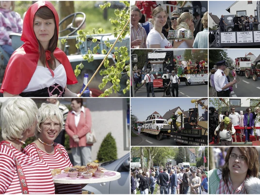 tengern-maifeier.jpg Maifeier in Tengern mit geschmückten Festwagen, verkleideten Teilnehmern und fröhlichen Zuschauern.