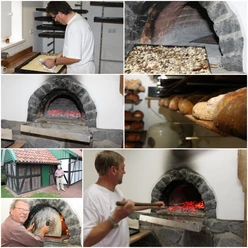 Ein traditioneller Steinofenbäcker zieht frisches, gebackenes Brot aus einem glühenden Steinofen.