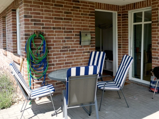 Die überdachte Terrasse der Ferienwohnung in Scheeßel Ferienwohnung - Wohnen wie Zuhause Terasse