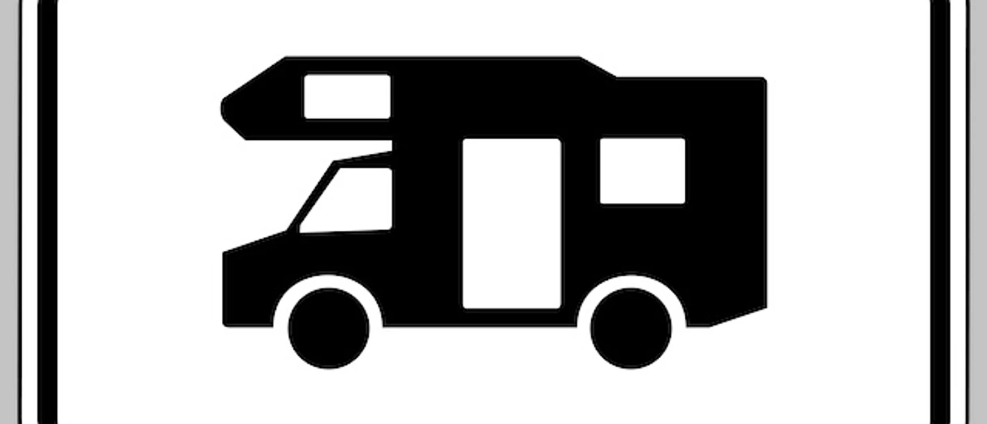 Schwarzes Wohnmobil-Piktogramm auf weißem Hinweisschild mit schwarzem Rahmen
