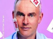 Alexander Graf Lambsdorff mit Kalenderblättern im Gesicht auf lila Hintergrund.