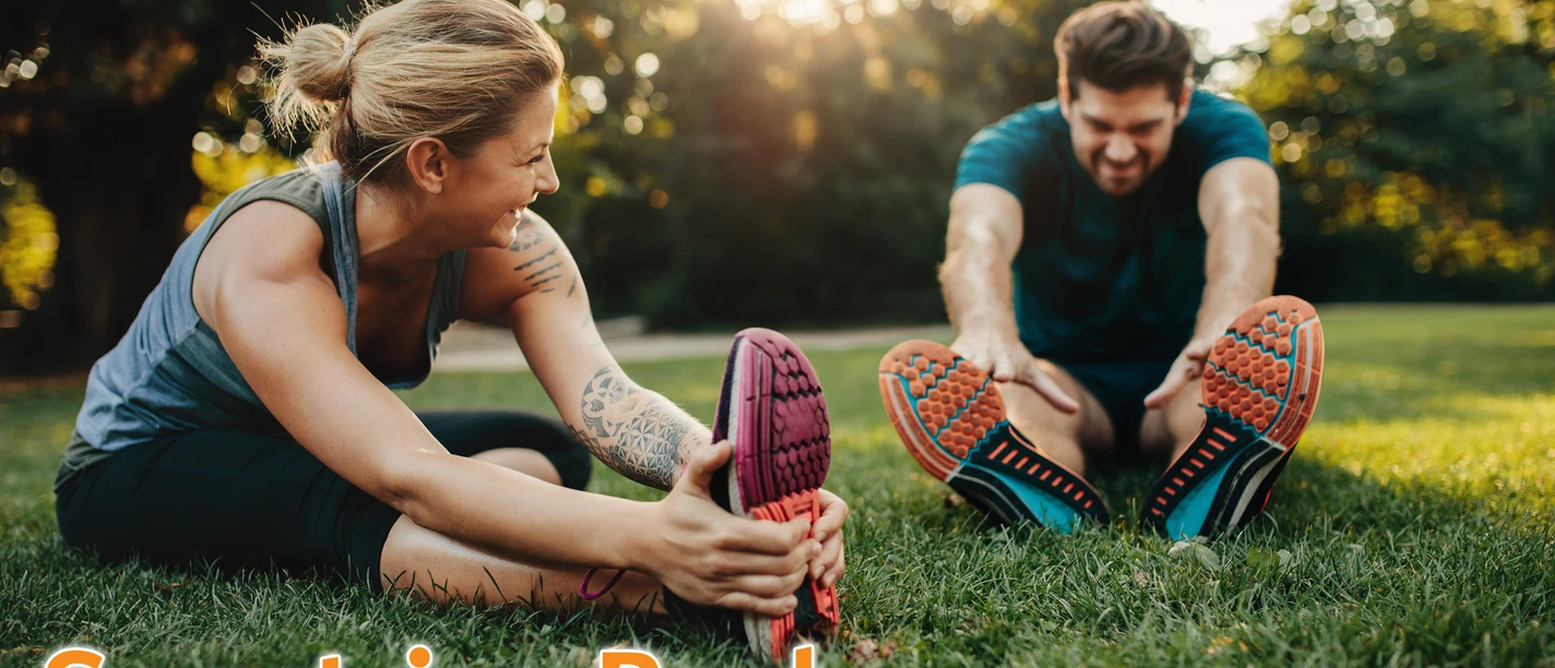 Sport im Park am Diemelsee Young caucasian couple exercising in park