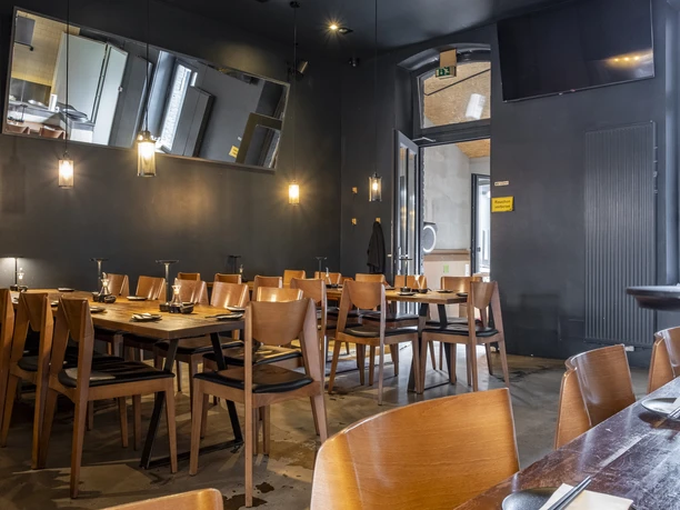 Daikan Izakaya Bar Dark walls give the room a cozy feel.