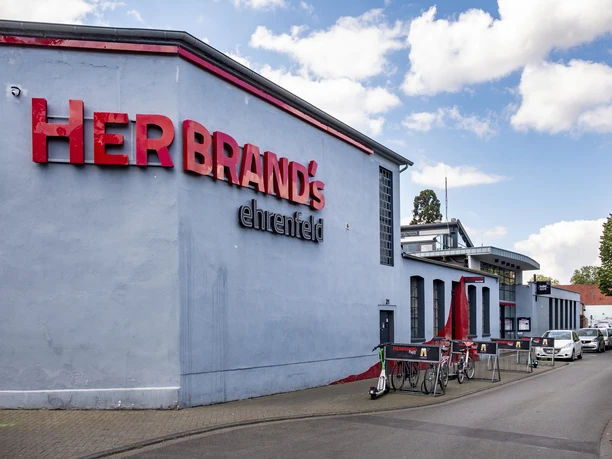 Herbrand's House front with the inscription Herbrands in large red letters.