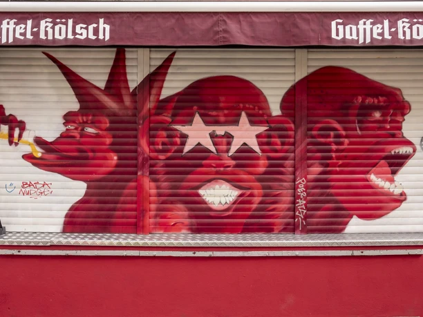 Lotta Bar Closed shutters with graffiti sprayed on them.