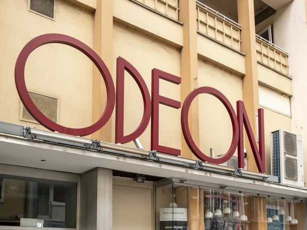 Odeon The Odeon cinema has a stylish entrance façade with large windows and striking red lettering.