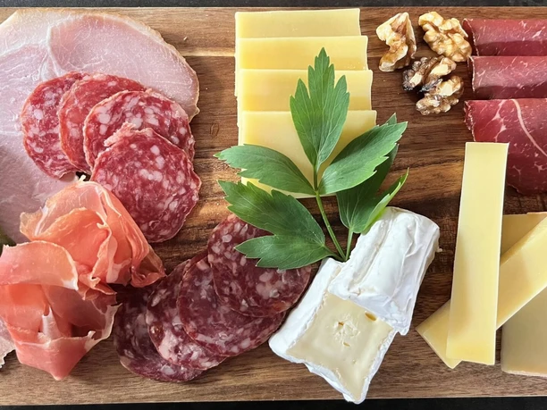Mixed platter at Kafi Arve Sausage and cheese on a wooden platter