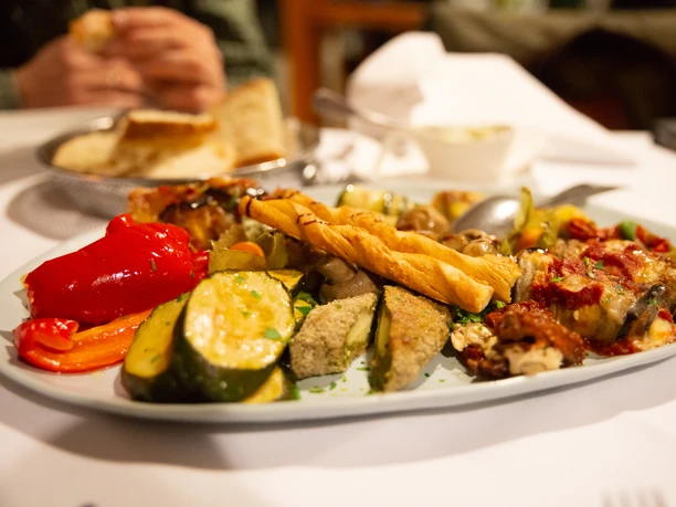 Plate filled with various antipasti