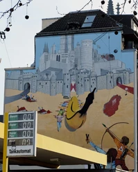 Mural Murals with surreal cityscapes, gothic towers and bananas in Cologne.