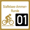 Wegweiser Graveltour Staffelsee Ammer Runde Wegweiser zur Graveltour Staffelsee-Ammer Runde mit Radfahrer-Symbol.