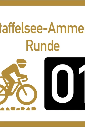 Wegweiser Graveltour Staffelsee Ammer Runde Wegweiser zur Graveltour Staffelsee-Ammer Runde mit Radfahrer-Symbol.
