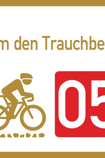 Wegweiser Graveltour Um den Trauchberg Wegweiser zur Graveltour "Um den Trauchberg" mit Radfahrersymbol und Nummer 05.