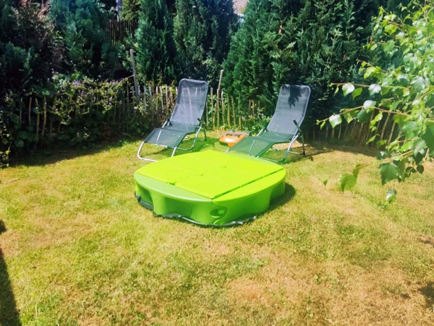 Sandkasten für die kleinen Gäste