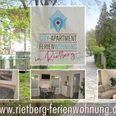 Ferienwohnung in Rietberg mit modernem Schlafzimmer, Küche und Wohnzimmer, umgeben von Natur.