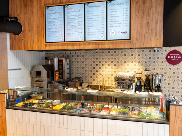 Restaurant Eat Kumpir Open service counter with fresh ingredients.