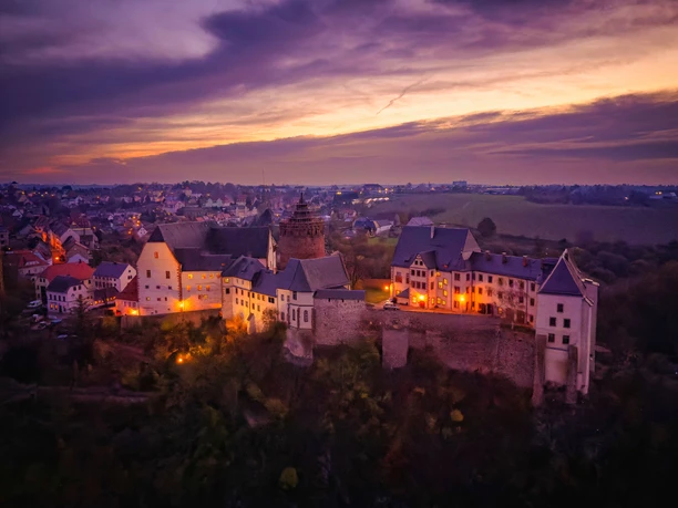Mildenstein Castle near Leisnig rises high above the river Mulde at sunset