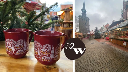 WGW Weihnachtsmarkt Zwei rote Tassen mit winterlichem Motiv auf einem Weihnachtsmarkt vor einer Kirche im Hintergrund.