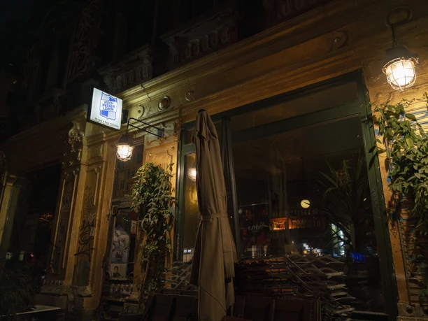 The façade of the "Noch Besser Leben" bar is painted in an eye-catching and shiny gold tone