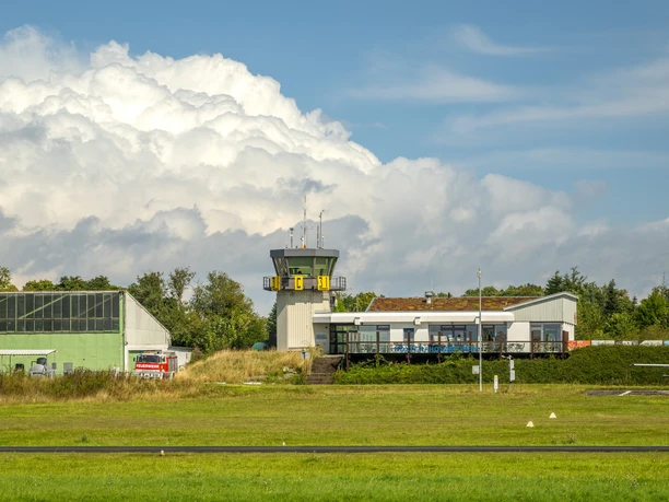 Airfield building with tower and hangar