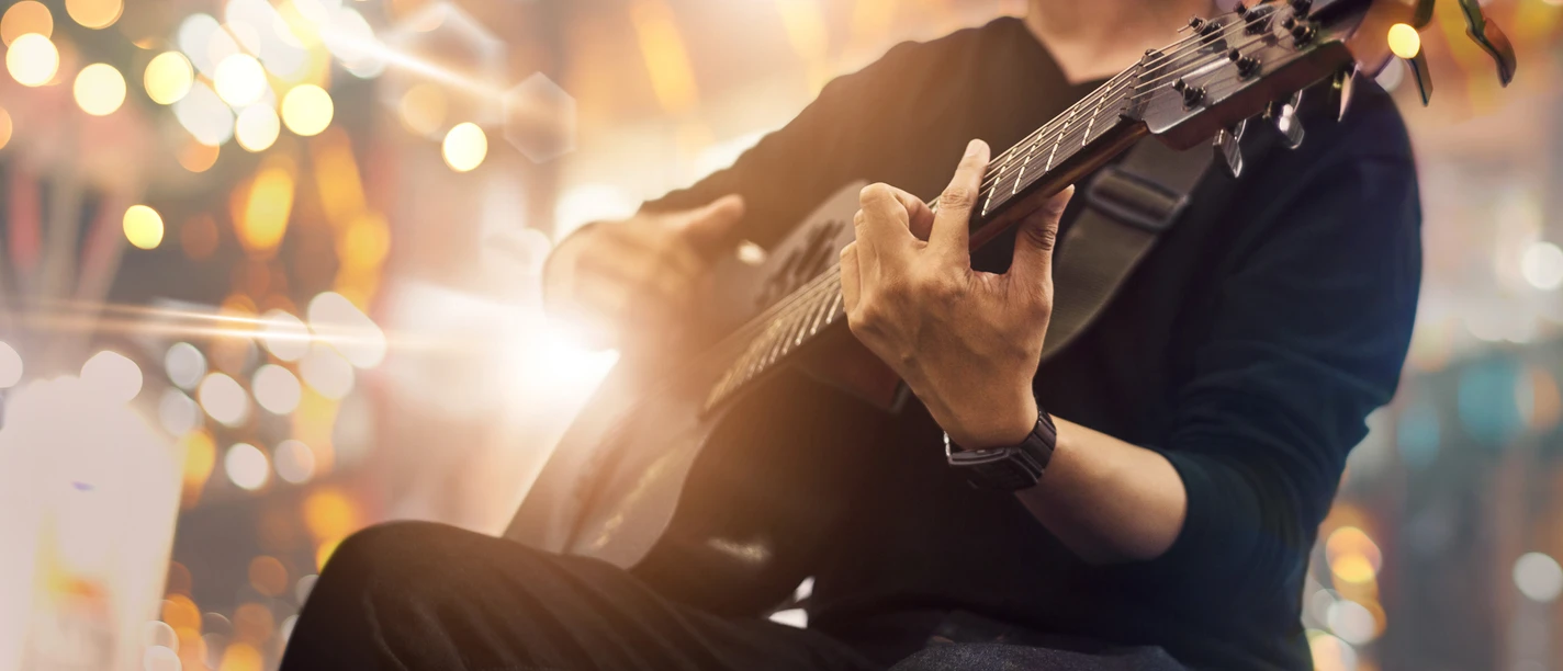 Guitarist,On,Stage,And,Sings,At,A,Concert,For,Background,