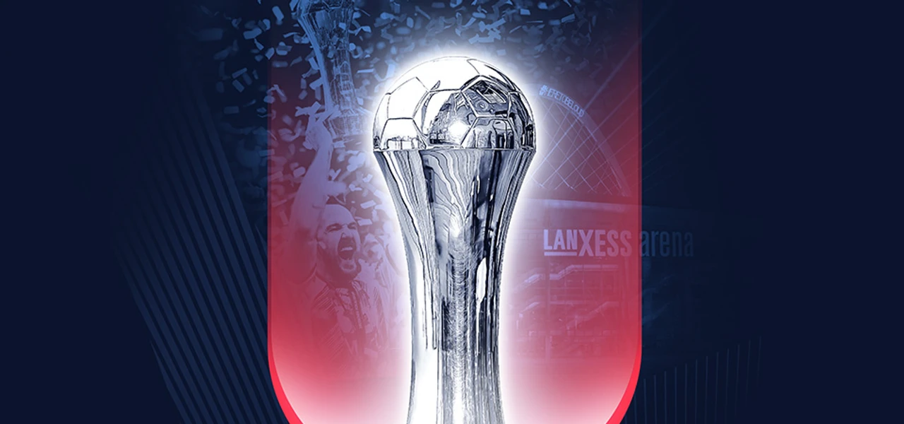 Lidl-Final4-Lanxess-arena.jpg Silberner Pokal auf rotem Hintergrund vor der Lanxess Arena. Der Pokal hebt sich glänzend ab.Silver trophy on a red background in front of the Lanxess Arena. The trophy stands out brilliantly.