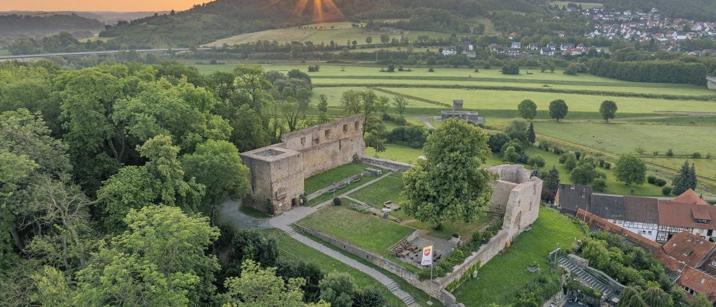 A bird's eye view of Heldenburg Castle in Salzderhelden at sunrise.