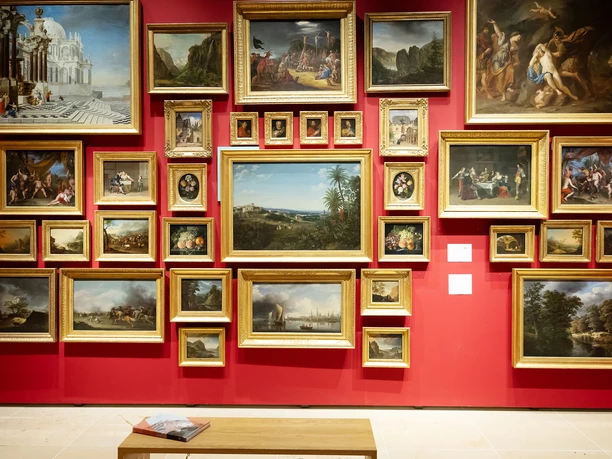 Historical Museum Gallery wall with Baroque paintings on red backdrop