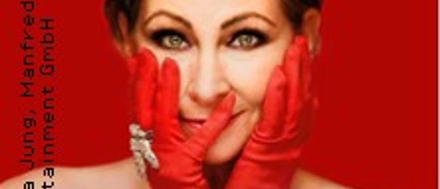 Claudia Jung lächelnd mit roten Handschuhen vor weißem Hintergrund, Schriftzug "30 Jahre Jubiläumstour".