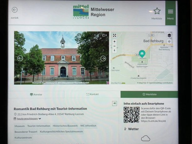 An information kiosk with a screen displays tourist information and maps for Bad Rehburg.