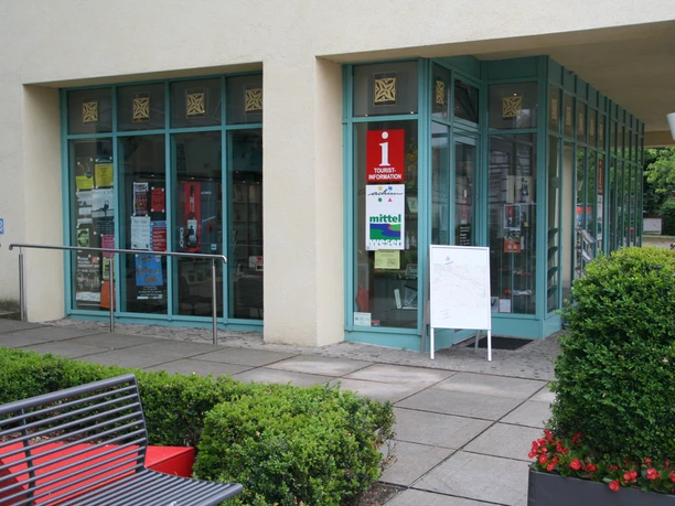 Tourist Information Achim with barrier-free access, modern glass façade design and information sign.