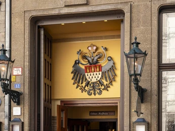 Früh am Dom Cologne's emblem with an eagle above the entrance to the brewery.