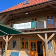 Café Neudeich auf Wangerooge.jpg Außenaufnahme des Ausflugslokals Café Neudeich in der Sonne.