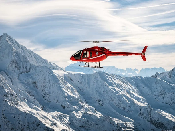 mountain-flyers-belp-titelbild-helokopter-berge-schnee.jpg