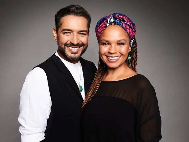 Gianni Jovanovic Oyindamola Alashe Gianni Jovanovic and Oyindamola Alashe smile warmly into the camera against a neutral background.