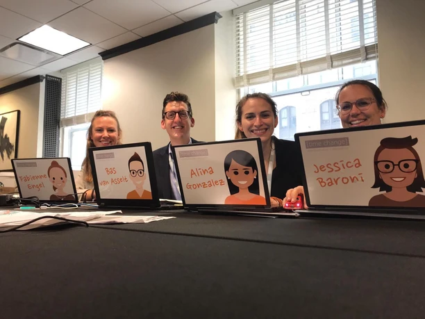 Time Change GmbH The Time Change GmbH team sits smiling at the registration counter.