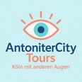 Logo von AntoniterCity Tours mit stilisiertem Auge und dem Motto "Köln mit anderen Augen".