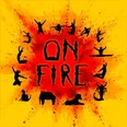 Das Bild zeigt silhouettierte Tänzer*innen in dynamischen Posen um den Schriftzug "ON FIRE" auf gelbem Hintergrund.