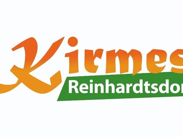 Logo der Kirmes Reinhardtsdorf mit orangefarbenem Schriftzug und grünem Hintergrund für Ortsnamen.