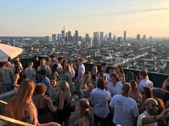 Radio Frankfurt- Skyline Studios Rooftop party with city view and many guests