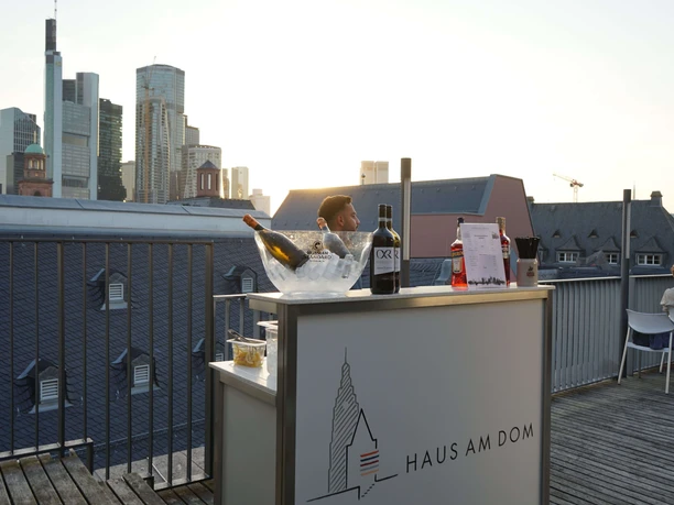 Haus am Dom - bar Rooftop bar with drinks and skyline at sunset