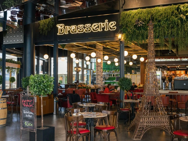 Brasserie at Foodtopia MyZeil Stylish brasserie with greenery, lights and Eiffel Tower model