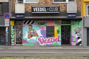 Veedel Club The Veedel Club in Cologne impresses with its lively street art, colorful graffiti and creative façade design.