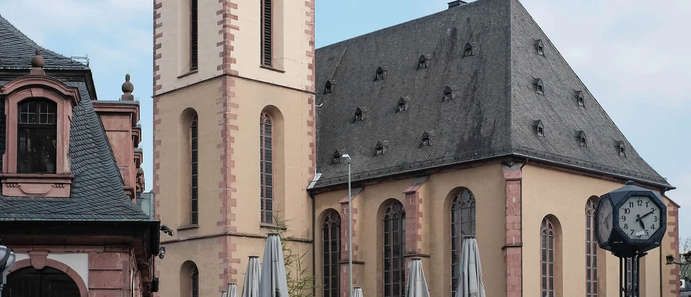 St. Katharinen Church Frankfurt, baroque, people and café in foreground.
