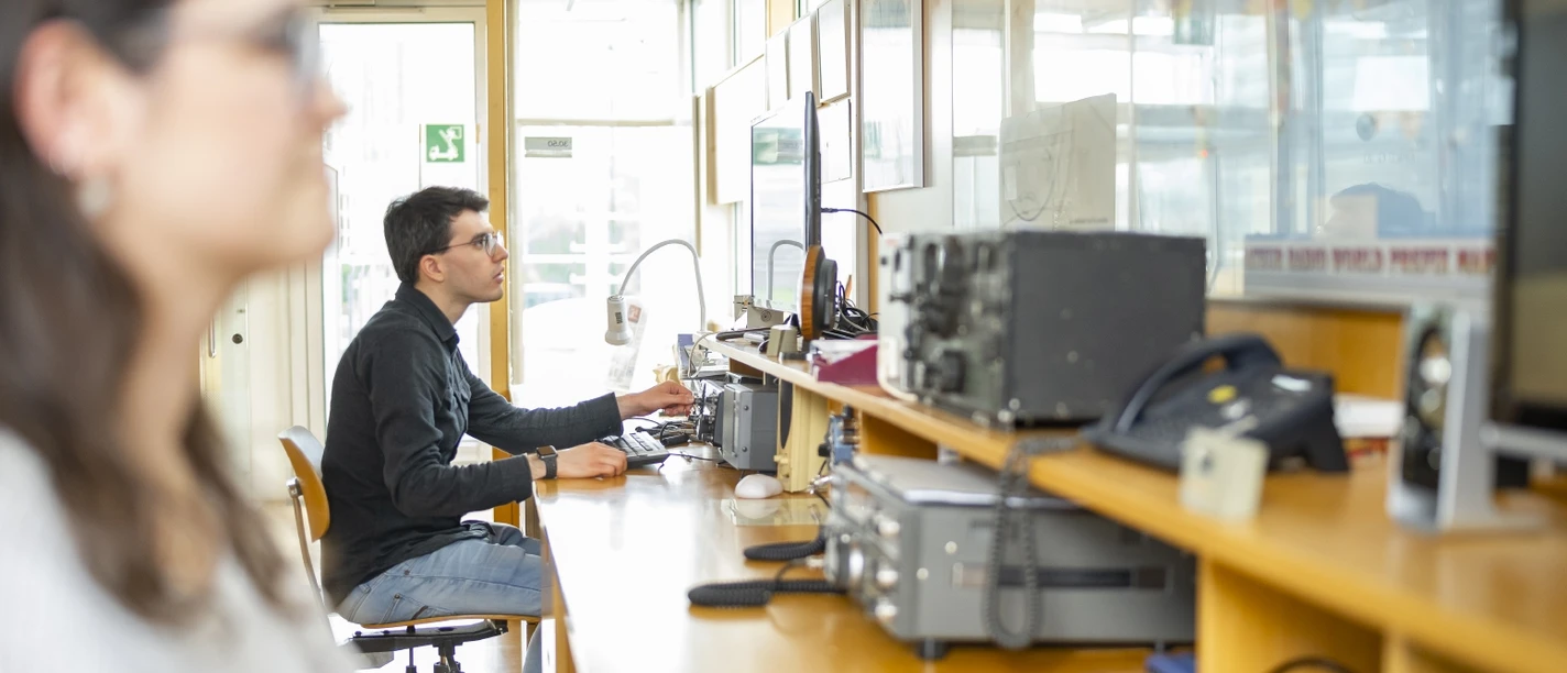 Radio Operators' Station at the Museum of Communication in Frankfurt People operating radio equipment in radio station
