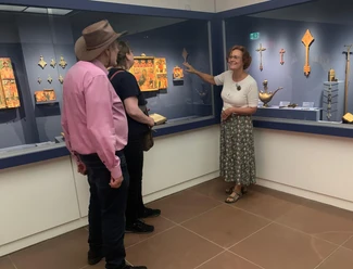 Curator Explains Ethiopian Icons and Crosses to Visitors at the Icon Museum in Frankfurt