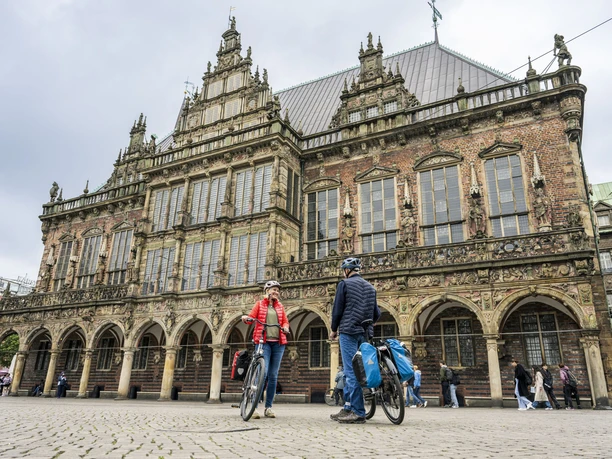 Bremen Rathaus Cyclists in front of Bremen's historic town hall.