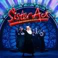 Sister Act Musical: Ordensschwestern tanzen in mitreißender Inszenierung vor farbenfrohem Bühnenhintergrund.