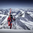 Ascent with skis on the Eggishorn Aletschgletscher Rundtour Ski mit Bergsteiger im Aufstieg am Eggishorn, Skier am Rucksack, mit Blick auf die Walliser AlpenAletsch Glacier round tour Ski with climber on the Eggishorn, skis on rucksack, with a view of the Valais AlpsCircuit du glacier d'Aletsch Ski avec alpiniste en ascension à l'Eggishorn, skis sur le sac à dos, avec vue sur les Alpes valaisannes