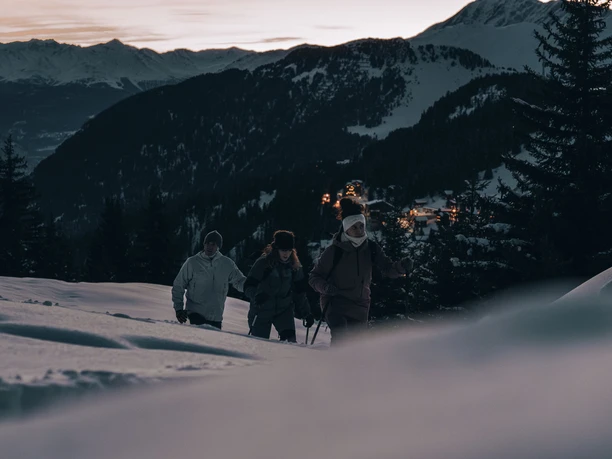The evening atmosphere during a snowshoe hike. Full moon fondue Bättmerhitta in the Aletsch Arena with snowshoe hike at sunset and view of Bettmeralp